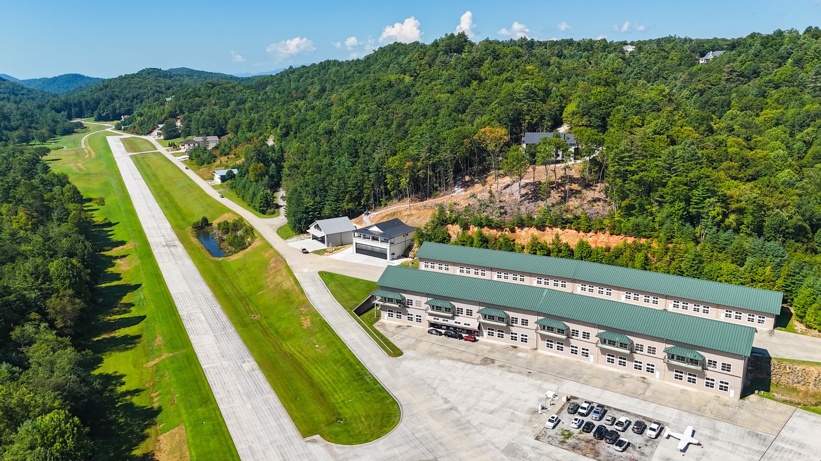 Aerial view of the hangar complex beside the runway